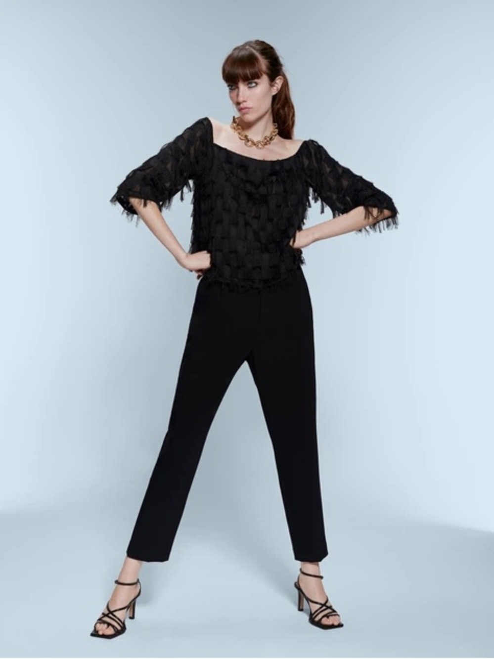 Zara fringe top features a boat neck design and semi-sheer fabric
